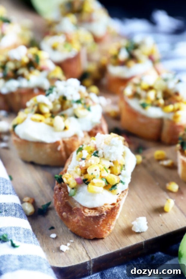 Zesty Grilled Elote Crostini 5 Another side angle of grilled mexican corn crostini on a platter