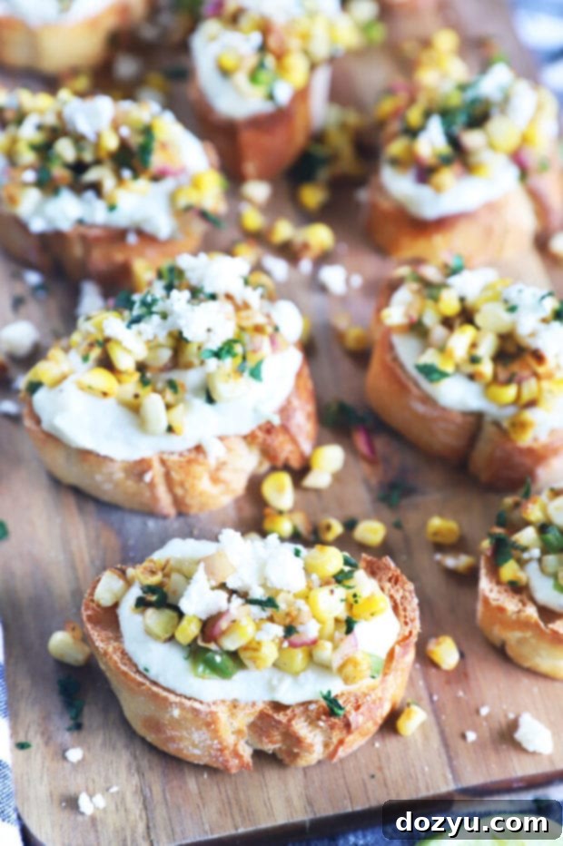 Zesty Grilled Elote Crostini 9 A beautifully presented platter of Mexican corn crostini, ready to serve