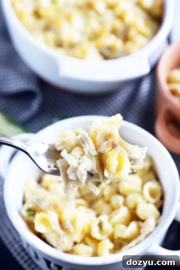 Mac and cheese on a fork, ready to be eaten