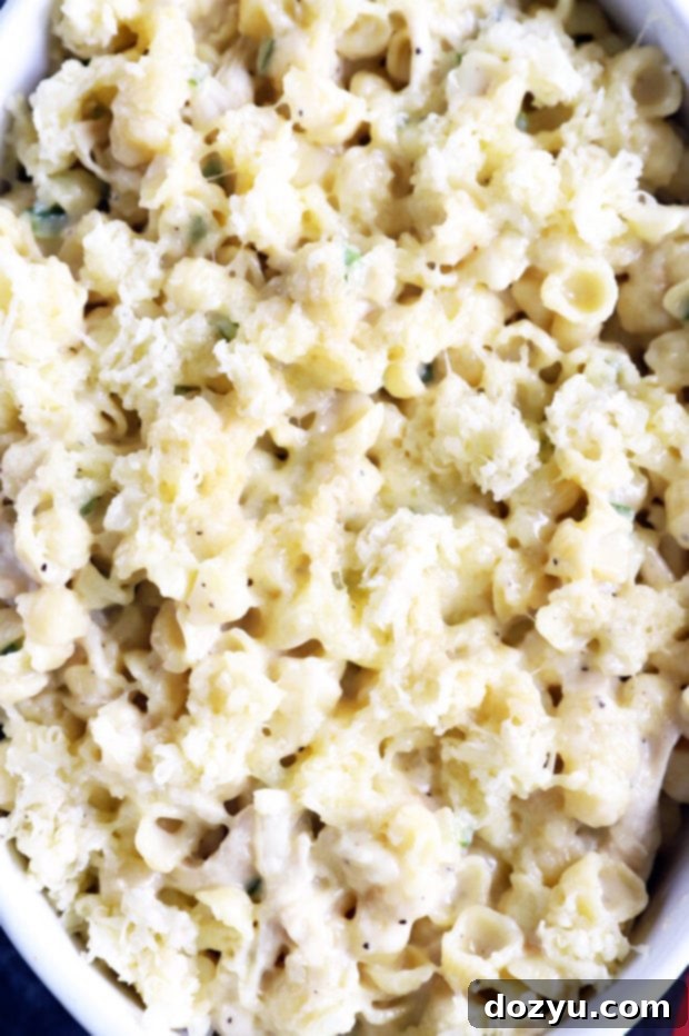 Overhead shot of havarti mac and cheese being mixed in a pot