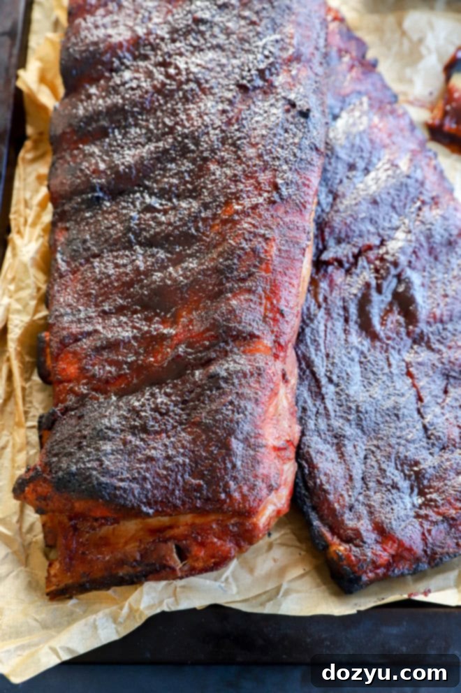 Fall-Off-The-Bone Apple Cider Traeger Ribs 8 pork ribs made on the traeger with parchment paper