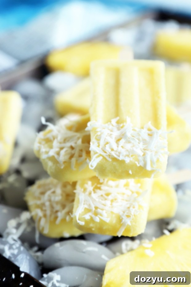 Tropical Pina Colada Popsicles 9 Stack of pineapple coconut popsicles photo, perfect for a recipe card visual