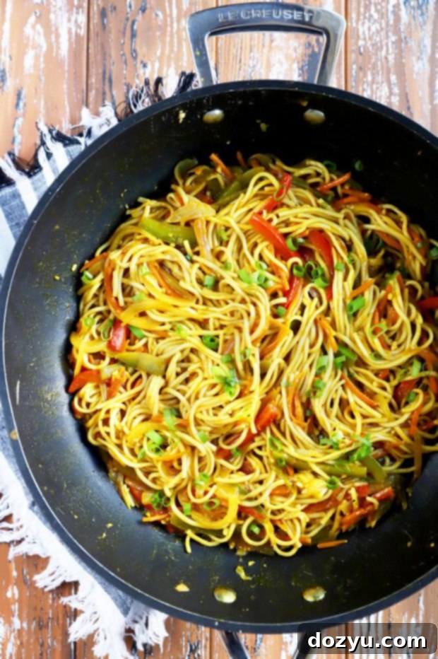 Sizzling Singapore Noodles 3 Overhead photo of asian takeout dish in pan