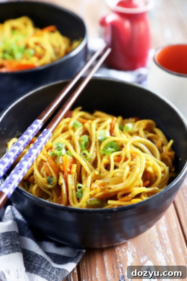 Sizzling Singapore Noodles 6 Chopsticks and Asian noodles picture