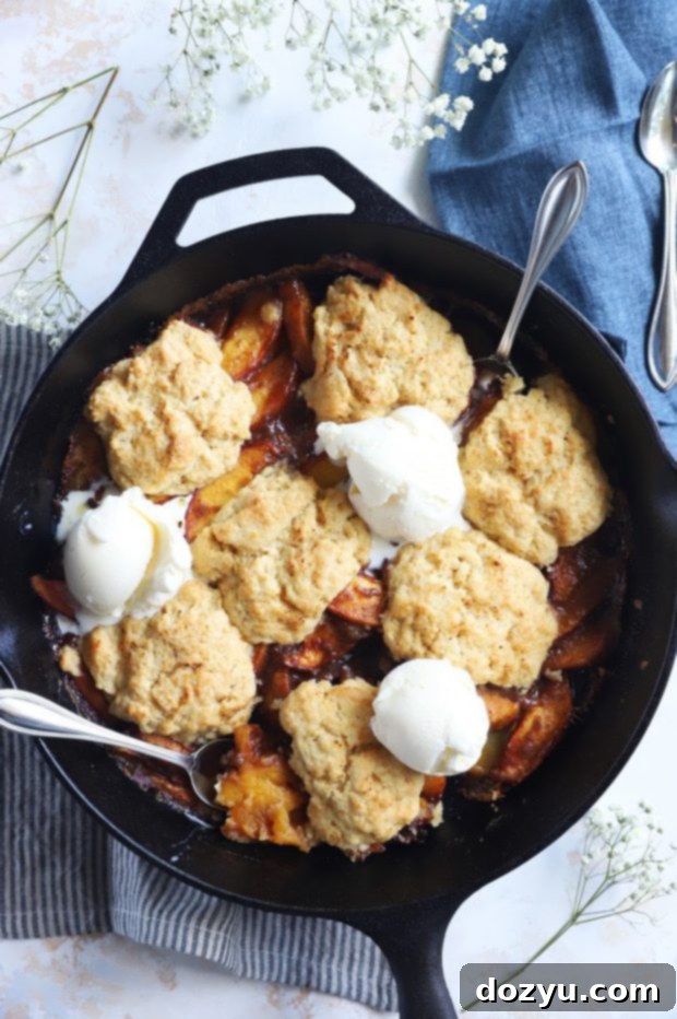 Flame-Kissed Peach Cobbler 2 Peaches with ice cream and biscuits image