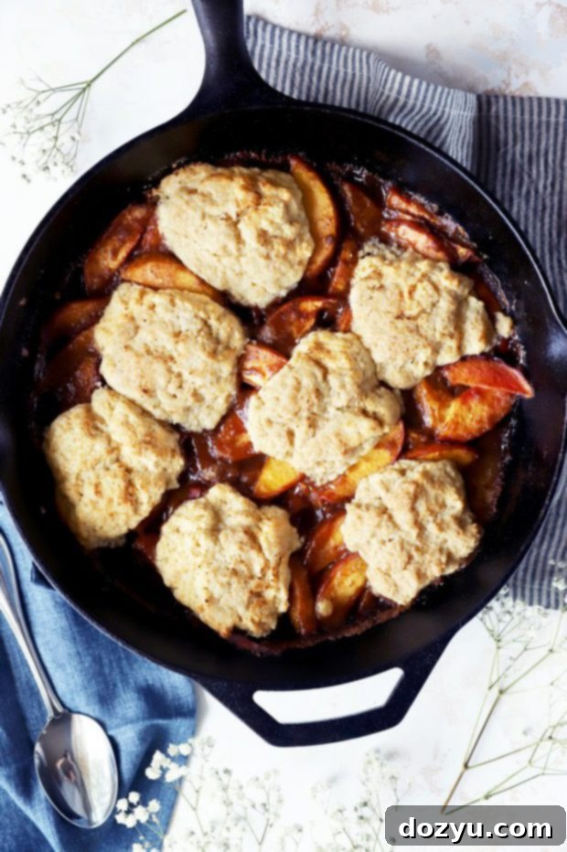 Flame-Kissed Peach Cobbler 4 Grilled peach cobbler in skillet photo
