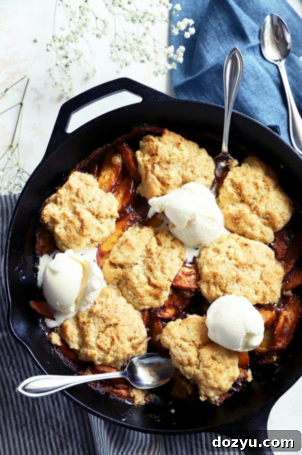 Flame-Kissed Peach Cobbler 8 Grilled peach cobbler with ice cream image