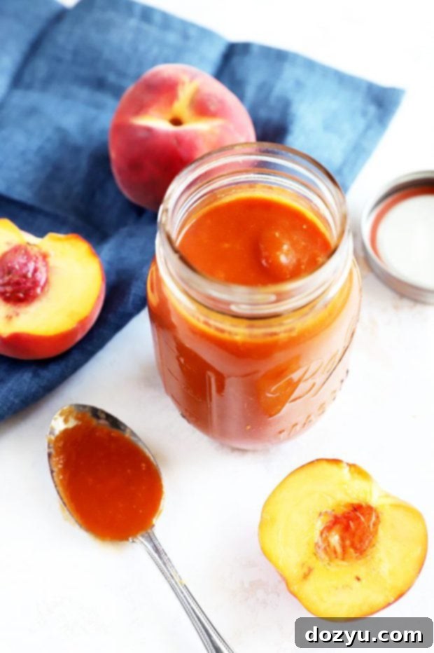Bourbon Peach BBQ Bliss 2 Homemade Bourbon Peach Barbecue Sauce in a jar with fresh peaches