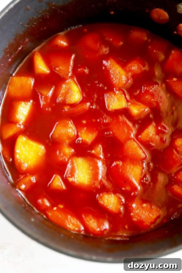 Bourbon Peach BBQ Bliss 6 Bourbon Peach BBQ Sauce simmering in a saucepan