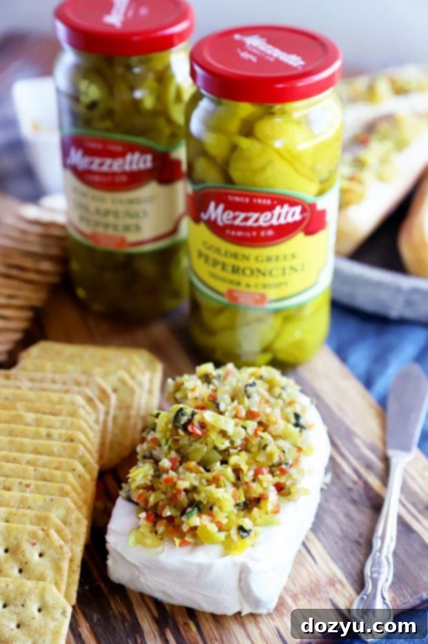 Zesty Pepperoncini Relish 7 Cream cheese appetizer with Mezzetta relish on crackers