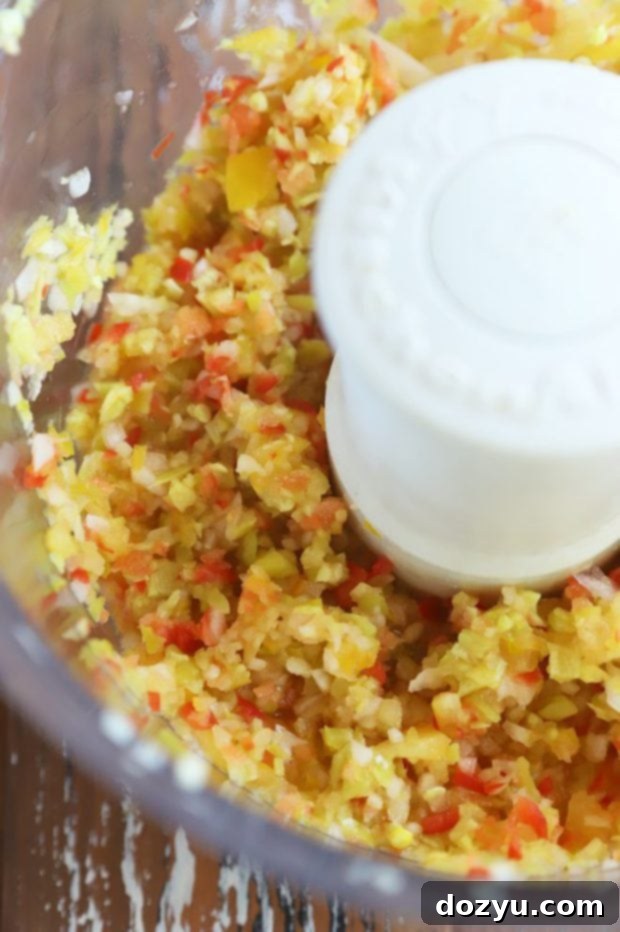 Zesty Pepperoncini Relish 9 Overhead image of relish ingredients being pulsed in a food processor