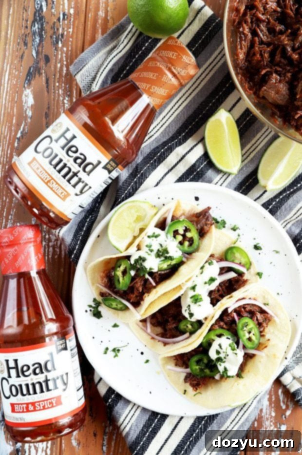 Overhead photo of BBQ tacos and Head Country BBQ sauce bottle