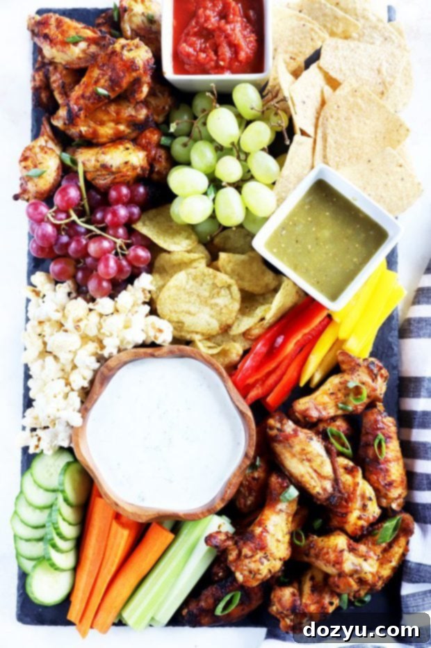 Epic Game Day Grazing Board 2 Overhead photo of easy-to-make wings board with various snacks and dips