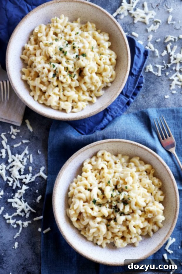 Instant Pot Creamy White Cheddar Mac and Cheese 2 White cheddar mac and cheese in two bowls image