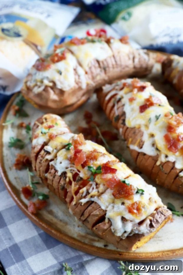 Sweet & Savory Maple Bacon Cheesy Hasselback Sweet Potatoes 7 Cheesy hasselback sweet potatoes on plate image