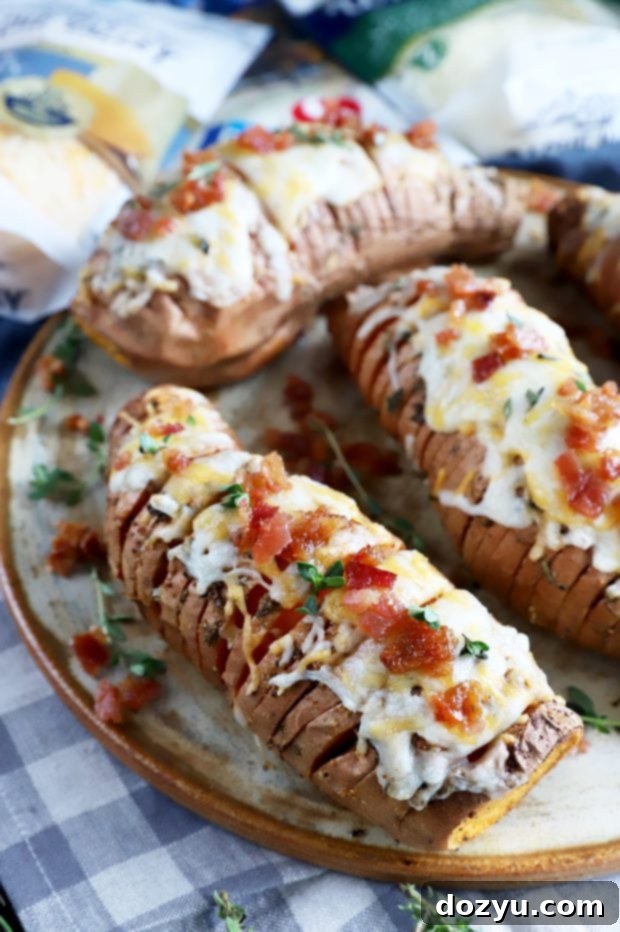 Sweet & Savory Maple Bacon Cheesy Hasselback Sweet Potatoes 10 Cheesy hasselback sweet potatoes on plate image