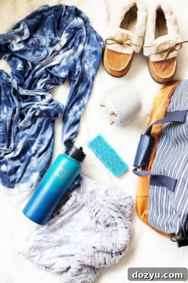 Overhead shot of neatly packed hospital bag essentials including clothes, toiletries, and baby items.