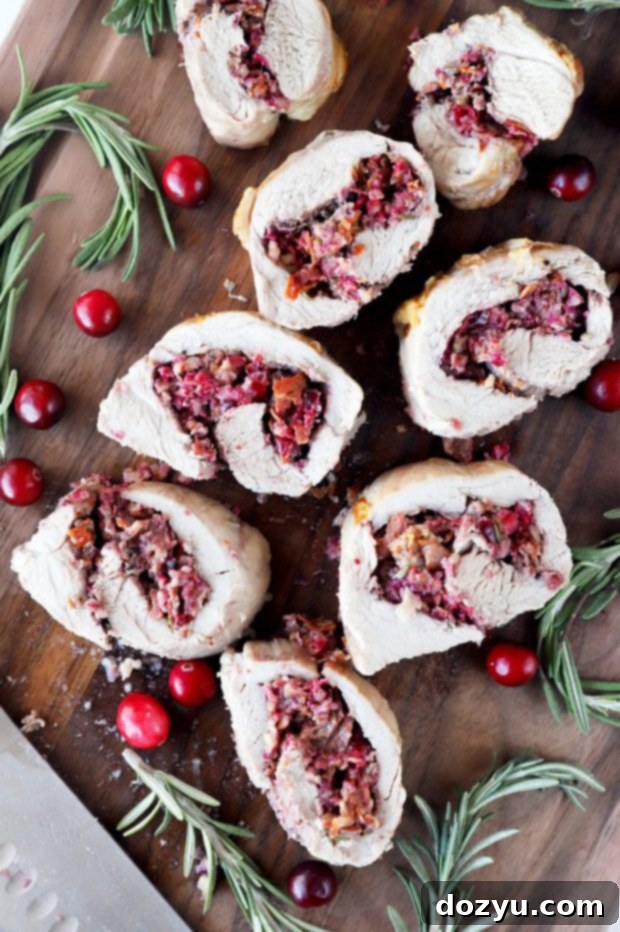 Festive Sheet Pan Stuffed Pork Tenderloin 3 Overhead photo of sliced stuffed pork tenderloin