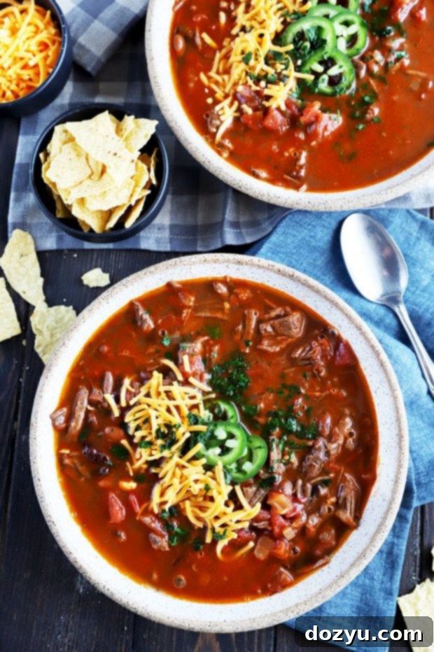 Tender Instant Pot Carne Asada Chili 6 Overhead photo of bowls of chili