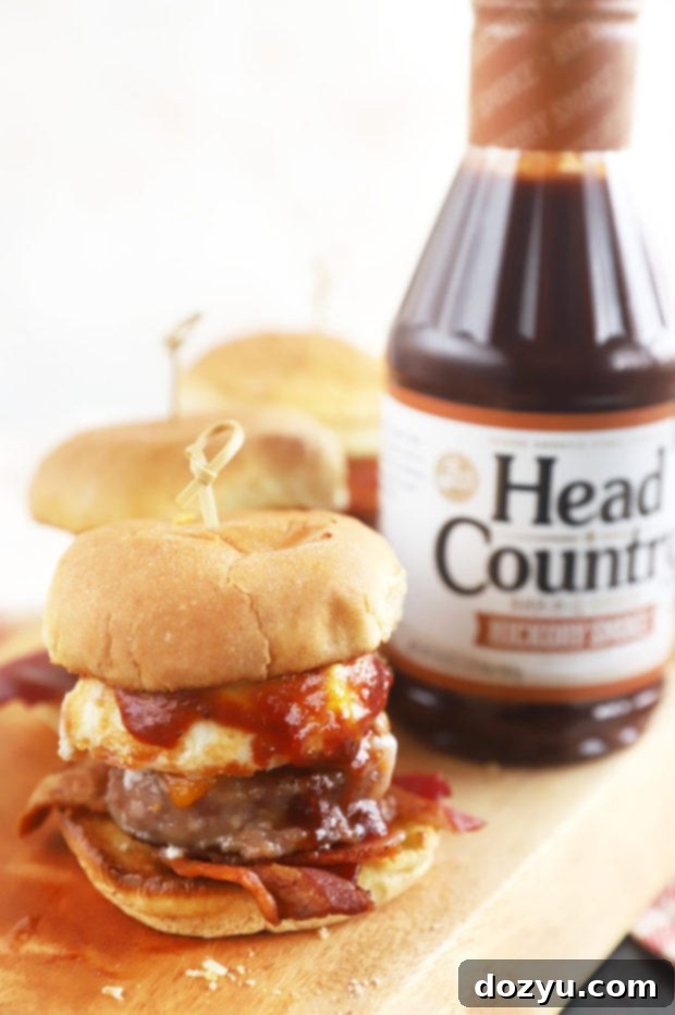 Cheesy BBQ Breakfast Pull-Aparts 2 Delicious slider with Head Country BBQ Sauce, showcasing a runny egg and crispy bacon