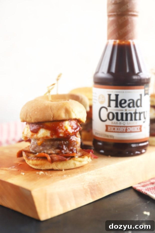Cheesy BBQ Breakfast Pull-Aparts 5 Side view of a breakfast slider revealing its delicious layers of ingredients