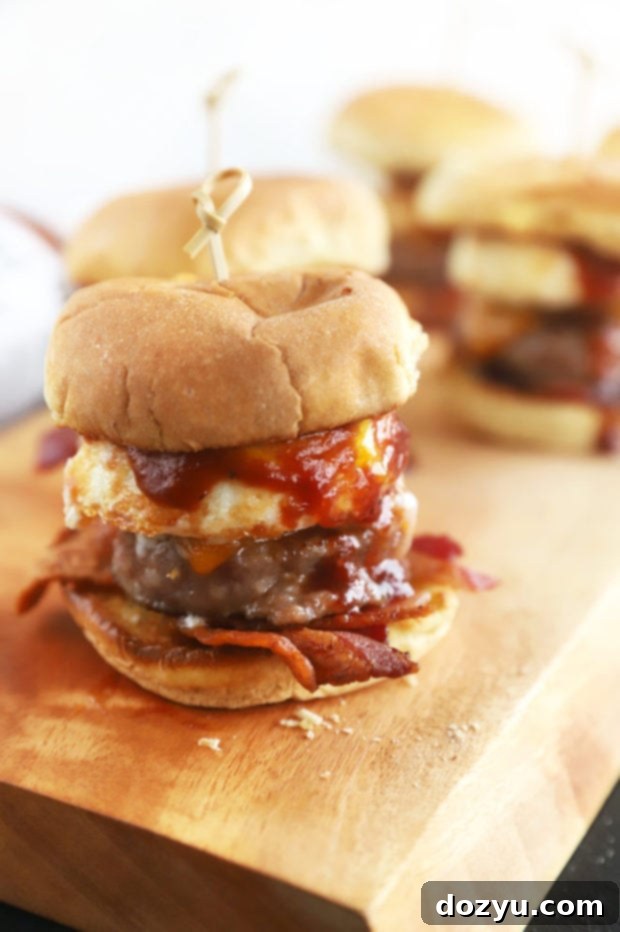 Cheesy BBQ Breakfast Pull-Aparts 7 Breakfast sliders neatly arranged on a wooden serving board