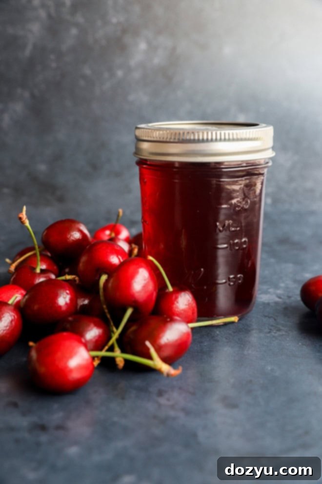 Sweet Cherry Elixir 5 cherry simple syrup in a jar with fresh cherries