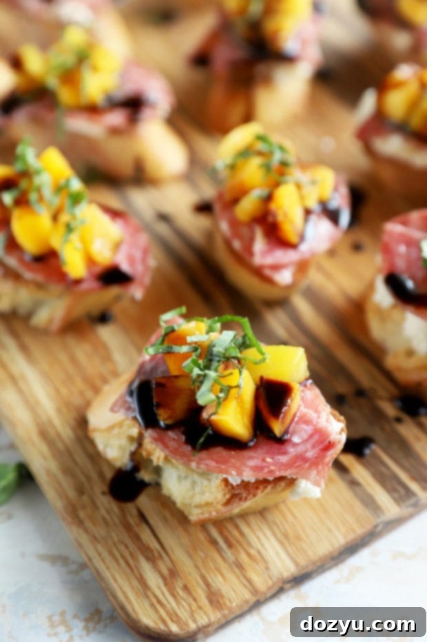 Salami peach ricotta crostini on platter image