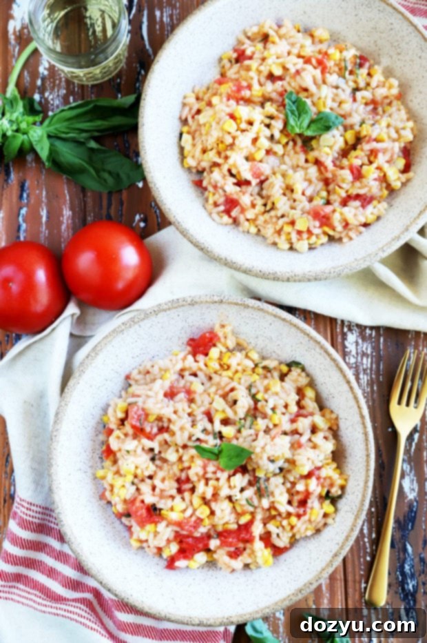 Sunkissed Corn and Tomato Risotto 5 Four servings of Summer Corn Tomato Risotto in bowls, garnished with generous amounts of fresh basil.