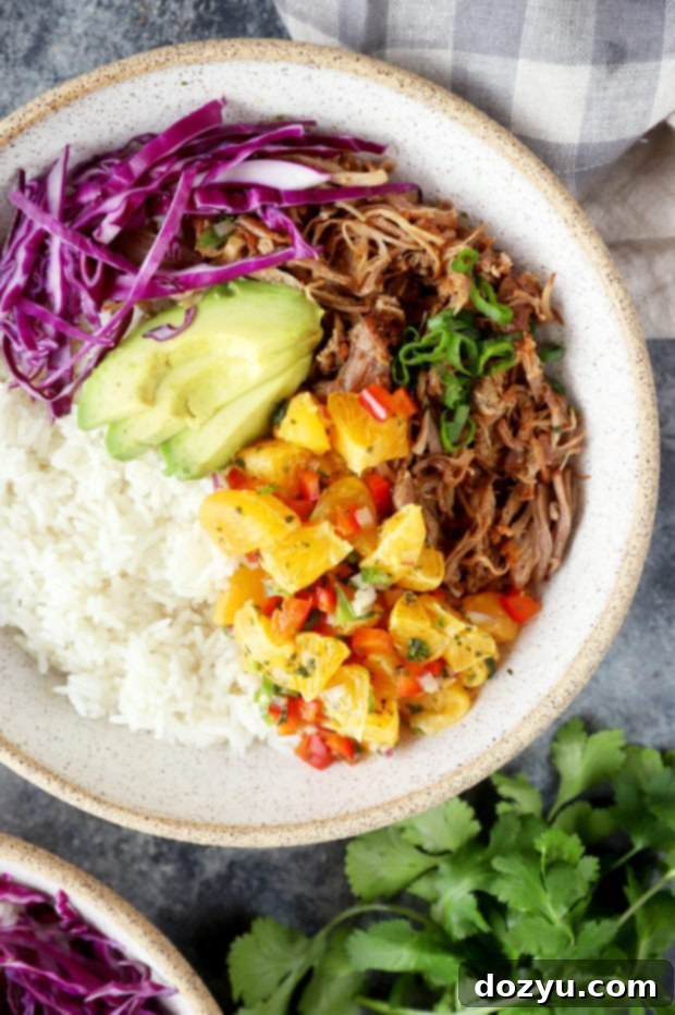 Zesty Teriyaki Pulled Pork Bowls with Mandarin Salsa 3 Close-up of a pulled pork bowl with vibrant mandarin salsa and fresh toppings