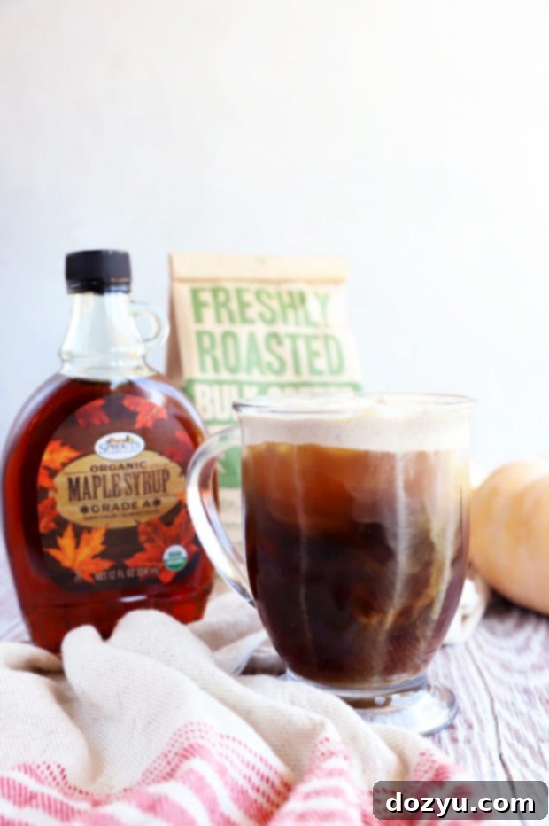Maple Sweet Cream Cold Brew 7 A glass of Maple Sweet Cream Cold Brew with a swirl of cream, and maple syrup drizzled on top for extra flavor.
