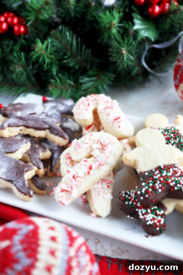 Candy cane shaped shortbread cookies artfully arranged on a holiday platter, showcasing festive decorations.
