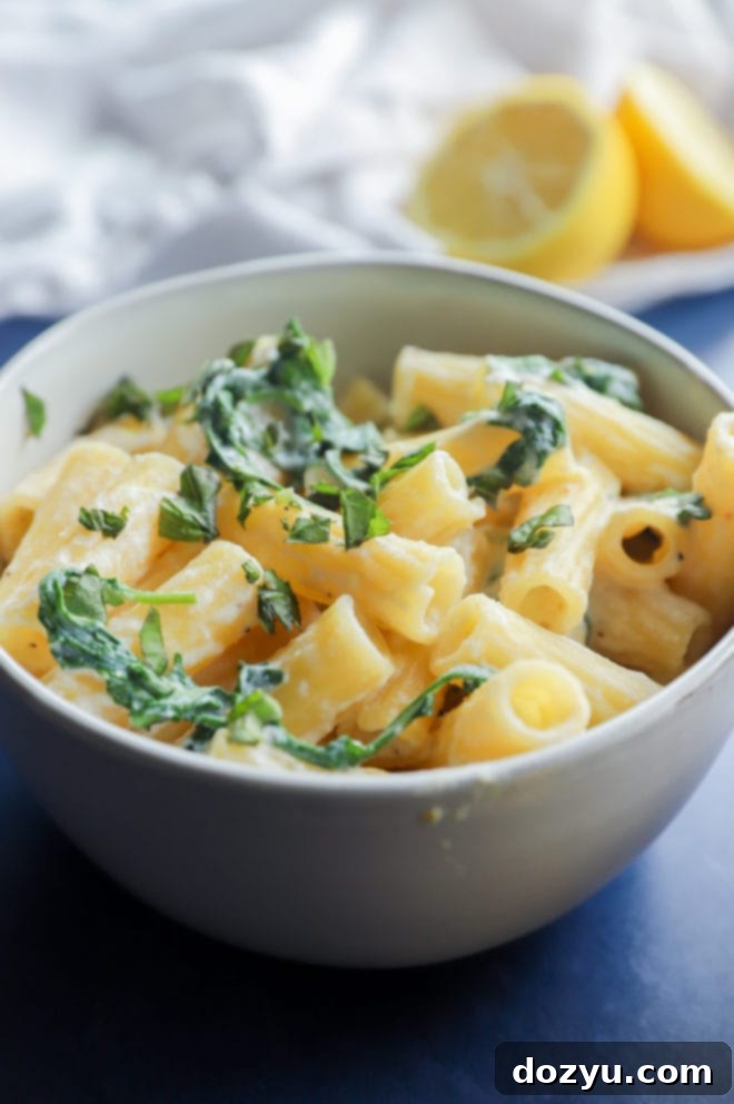 Lemony Cloud Pasta 4 Photo with backlight of lemon ricotta pasta in a bowl, showcasing its creamy texture
