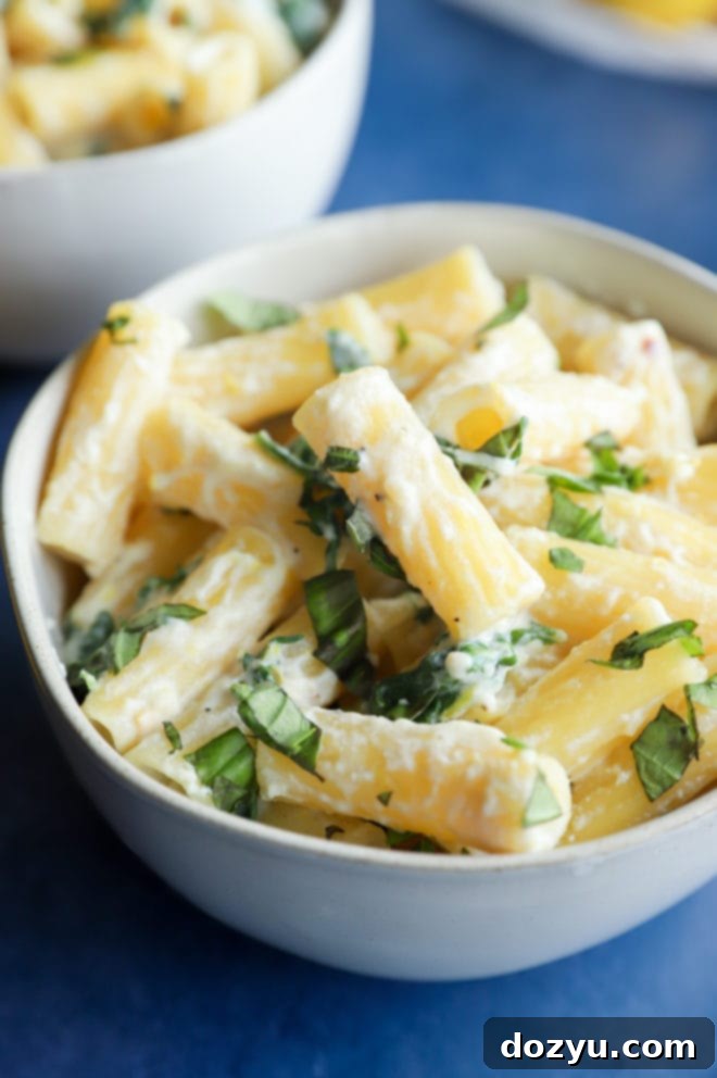 Lemony Cloud Pasta 6 Close-up image of Lemon Ricotta Pasta in a bowl, showing the texture and fresh basil garnish