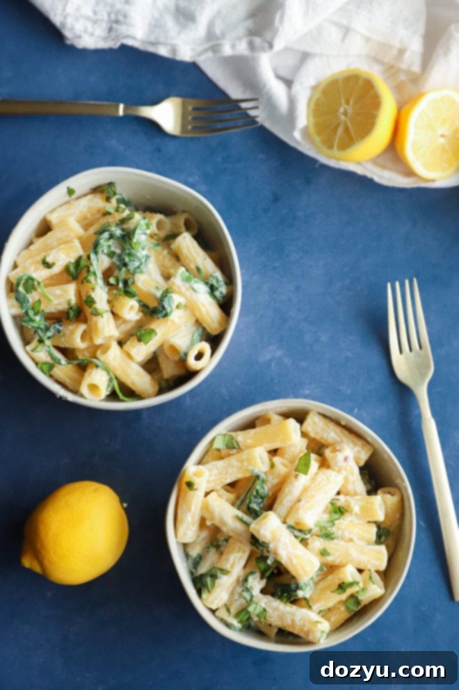 Lemony Cloud Pasta 7 Overhead image of lemon ricotta pasta in bowls with a focus on fresh ingredients and vibrant colors