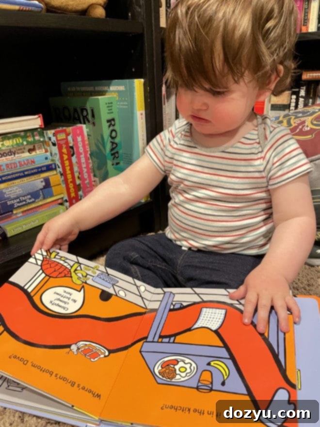 The Monthly Slice 2 Side photo baby reading a book mother's day - A beautiful image capturing a moment of a baby and mother, symbolizing the joys of motherhood and family connections, perfect for a Mother's Day celebration.