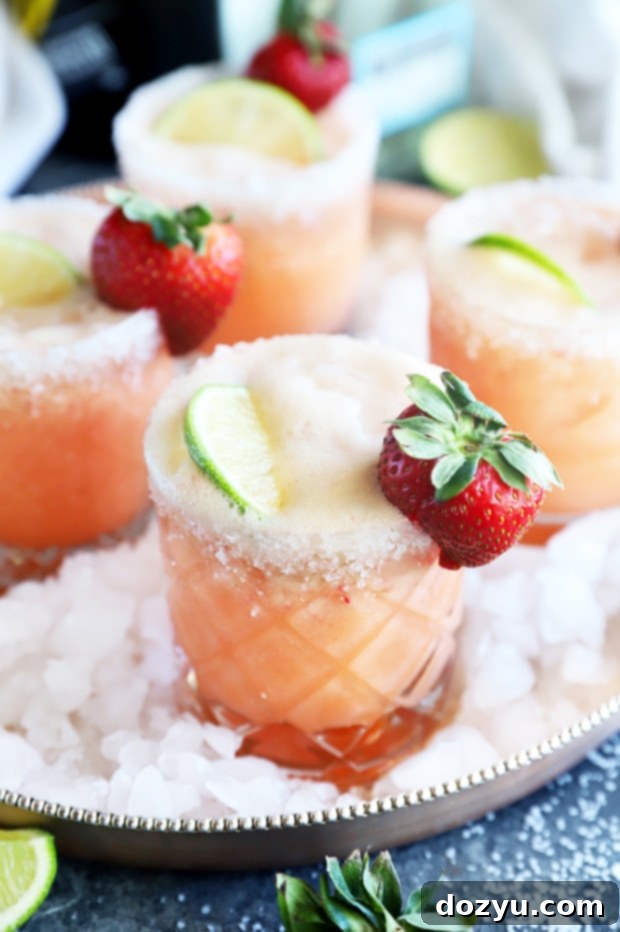 The Monthly Slice 3 Strawberry Margarita Champagne Cocktail Image - A vibrant, refreshing cocktail perfect for celebrating Mother's Day brunch or a festive happy hour.