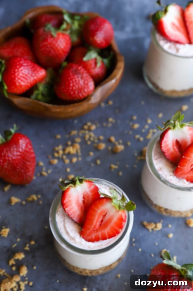 Whipped Strawberry Cheesecake Dream 8 Overhead image of mousse in jars with fresh berries