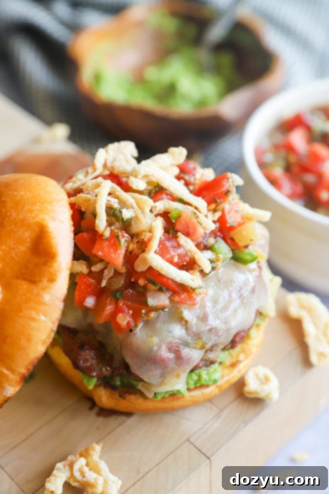 Fiery Salsa Jalapeño Crunch Burger 9 Side picture of Salsa Jalapeño Crunch Burger on a butcher's block with bowls of salsa and avocado