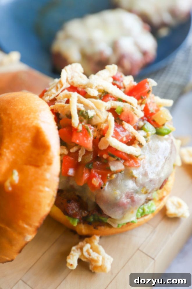 Fiery Salsa Jalapeño Crunch Burger 11 Photo of a burger with salsa and onions, ready to be picked up