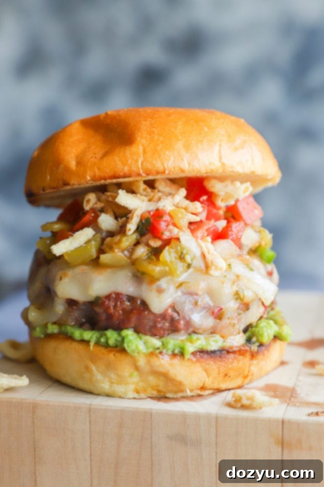 Fiery Salsa Jalapeño Crunch Burger 4 Photo of salsa burger on cutting board with all the toppings displayed