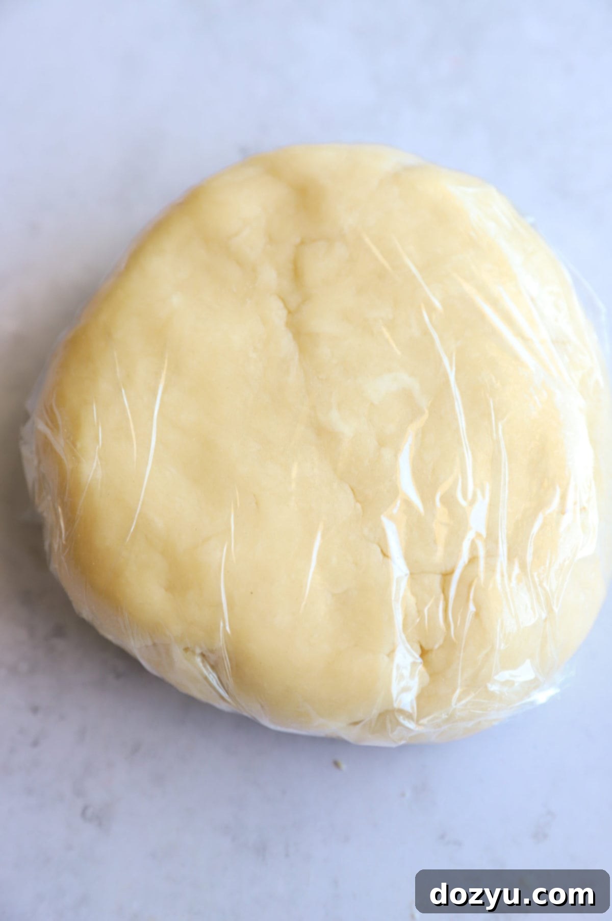 Galette dough wrapped in plastic wrap image
