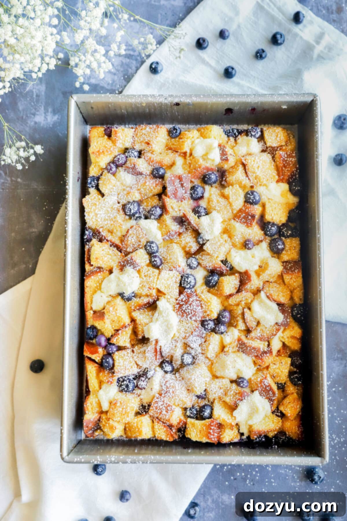 Blueberry & Cream Cheese French Toast Bake 10 Image of blueberry french toast casserole in pan