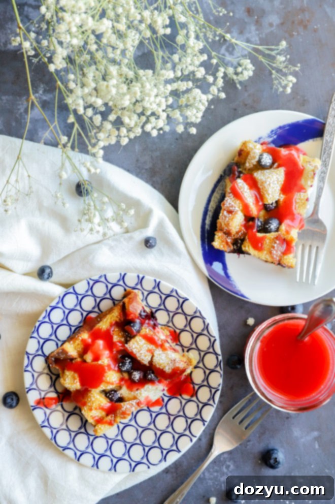 Blueberry & Cream Cheese French Toast Bake 8 Slices of a red, white, and blue breakfast bake, an overnight French toast casserole with blueberries.