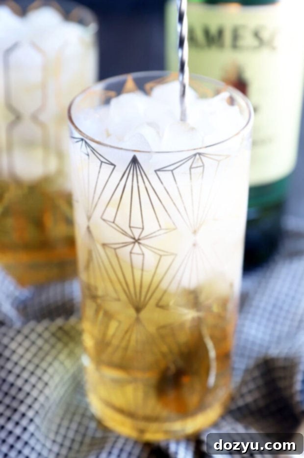 A trio of vibrant Jameson and Ginger cocktails, each with a lime wedge garnish, ready to celebrate St. Patrick's Day or any festive occasion.