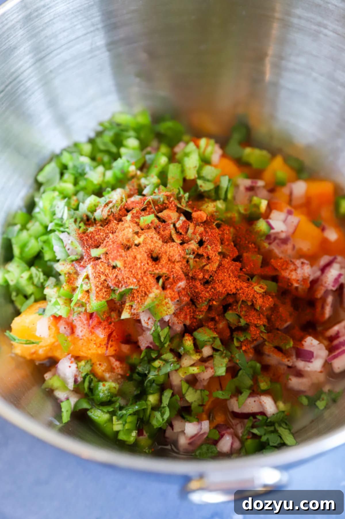 Sweet & Smoky Brats with a Peach-Bacon Kick 5 spicy bacon peach salsa ingredients in a bowl image