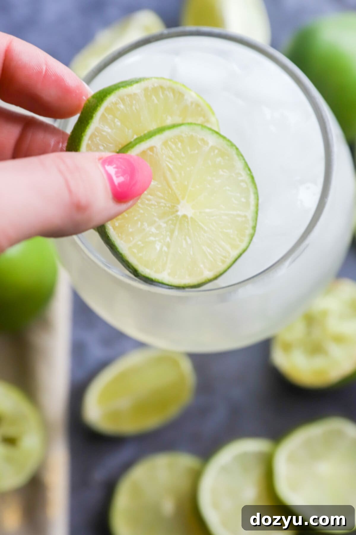 Add limes to a cocktail picture