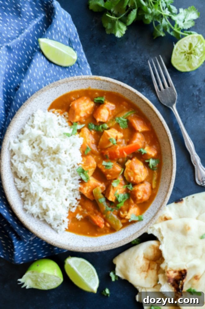 Easy Instant Pot Pumpkin Chicken Curry 8 Picture of chicken curry in a bowl with rice, ready to be eaten