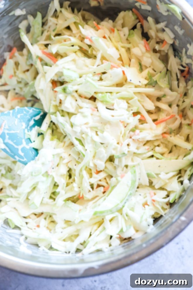 Tender BBQ Pulled Pork Sliders with Tangy Apple Coleslaw 5 Apple coleslaw in a bowl picture, vibrant and ready to be served