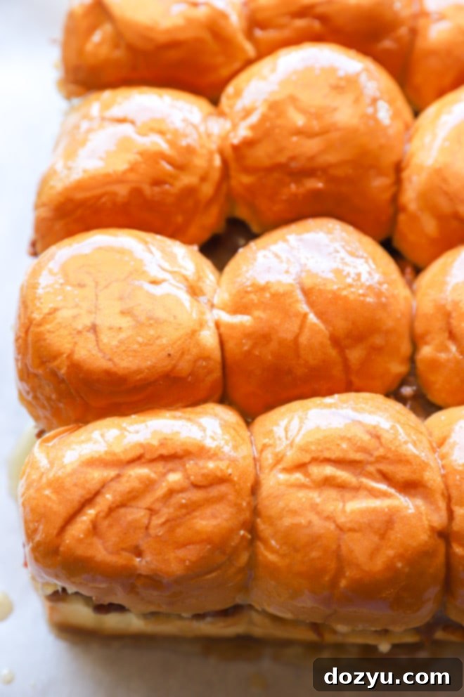 Tender BBQ Pulled Pork Sliders with Tangy Apple Coleslaw 8 sliders brushed with butter picture, ready for baking